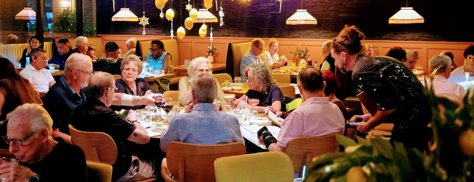 Family & Group Thursday Night dinner at Sole Mio Kitchen & Bar in Boynton Beach — multiple tables of guests dining together